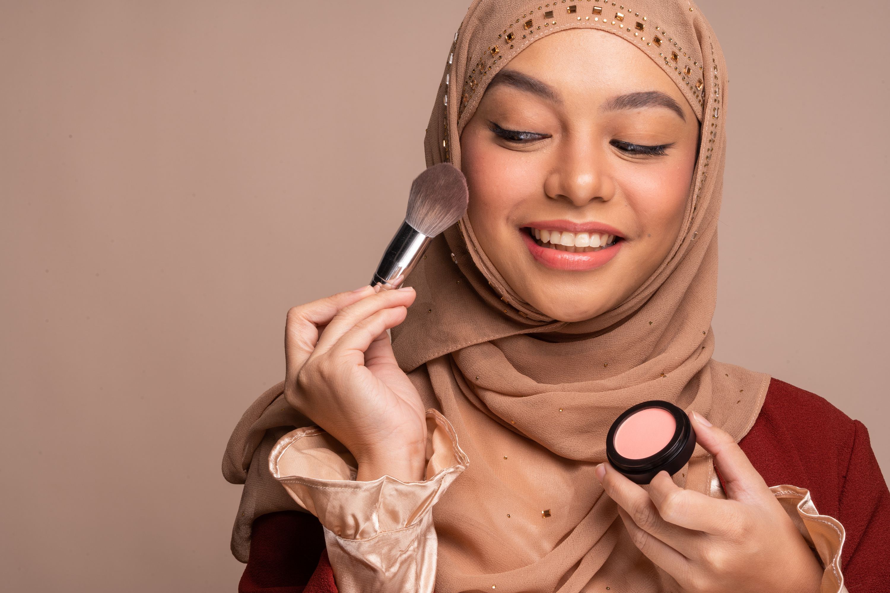 Woman Wearing Hijab and Applying Makeup
